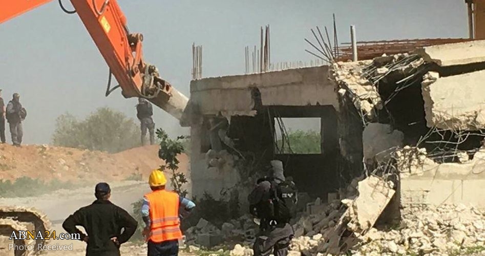 Israeli occupation forces demolishes a Palestinian house in Khader town