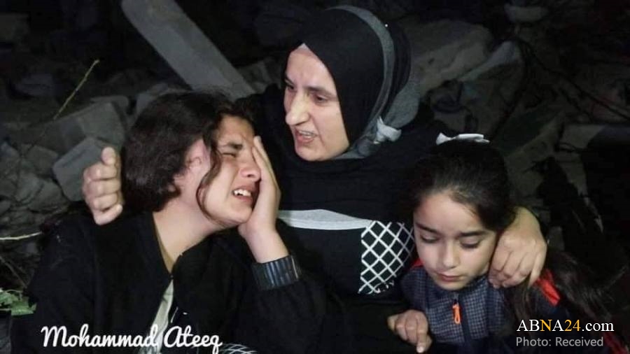 Photos: Family of Palestinian prisoner sitting on rubbles of their house after it demolished by Israeli regime forces in Nablus