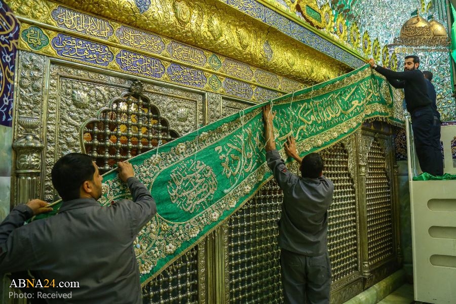 Photos: Decorating Al-Kadhimiya holy shrine with green banners on auspicious birth of Sayyida Zainab