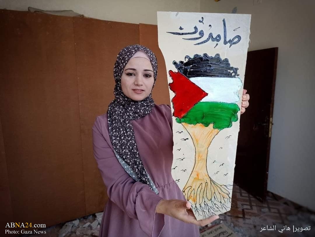  تقرير مصور / فنانة فلسطينية تشكيلية تحول ركام منزلها إلى لوحة ناطقة بالوجع