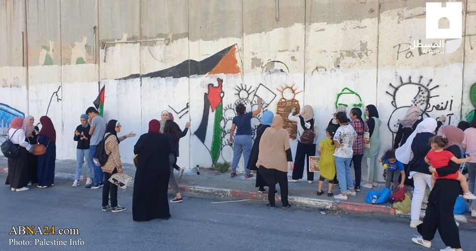 Israeli occupation forces attacks wall painting activity in Abu Dis, clashes with youths