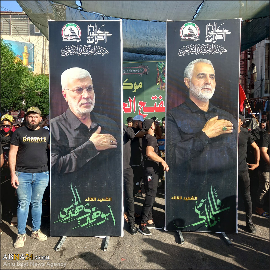 تقرير مصور/ زوار أربعينية الامام الحسين (ع) يحملون صورا لشهيدي "قاسم سليماني" و"ابو مهدي المهندس" 