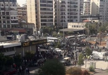 Six killed, dozens injured as armed groups shoot protesters from rooftops in Beirut
