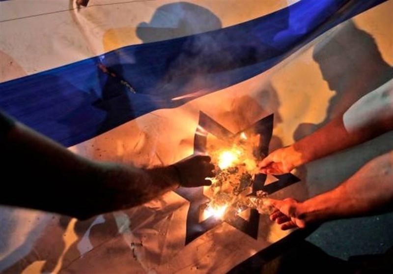 Moroccans set fire Israeli flag, call for end to Rabat's normalization with Zionists