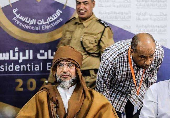 ردود الفعل تتوالى بعد عودة القذافي إلى السباق الانتخابي